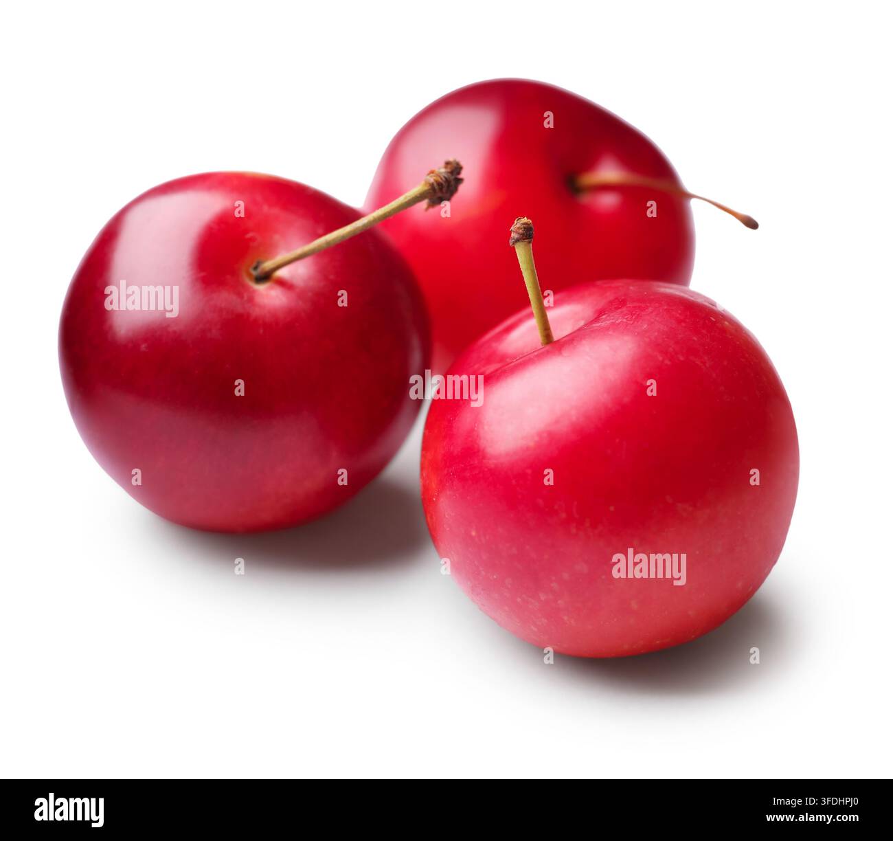 Three ripe cherry plums isolated on white Stock Photo