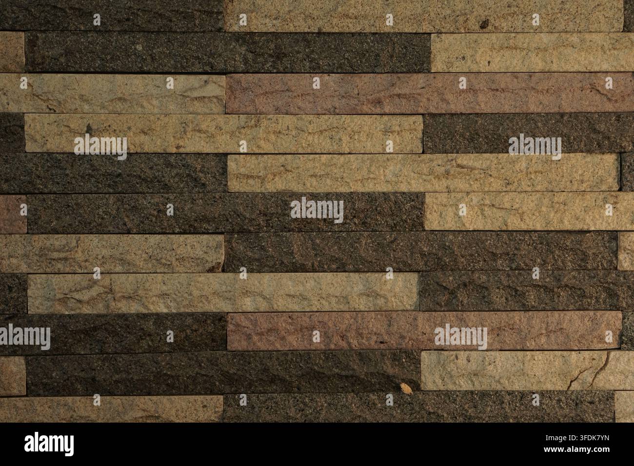 Textured stone brick wall cladding in earthy tones. Rectangular ...