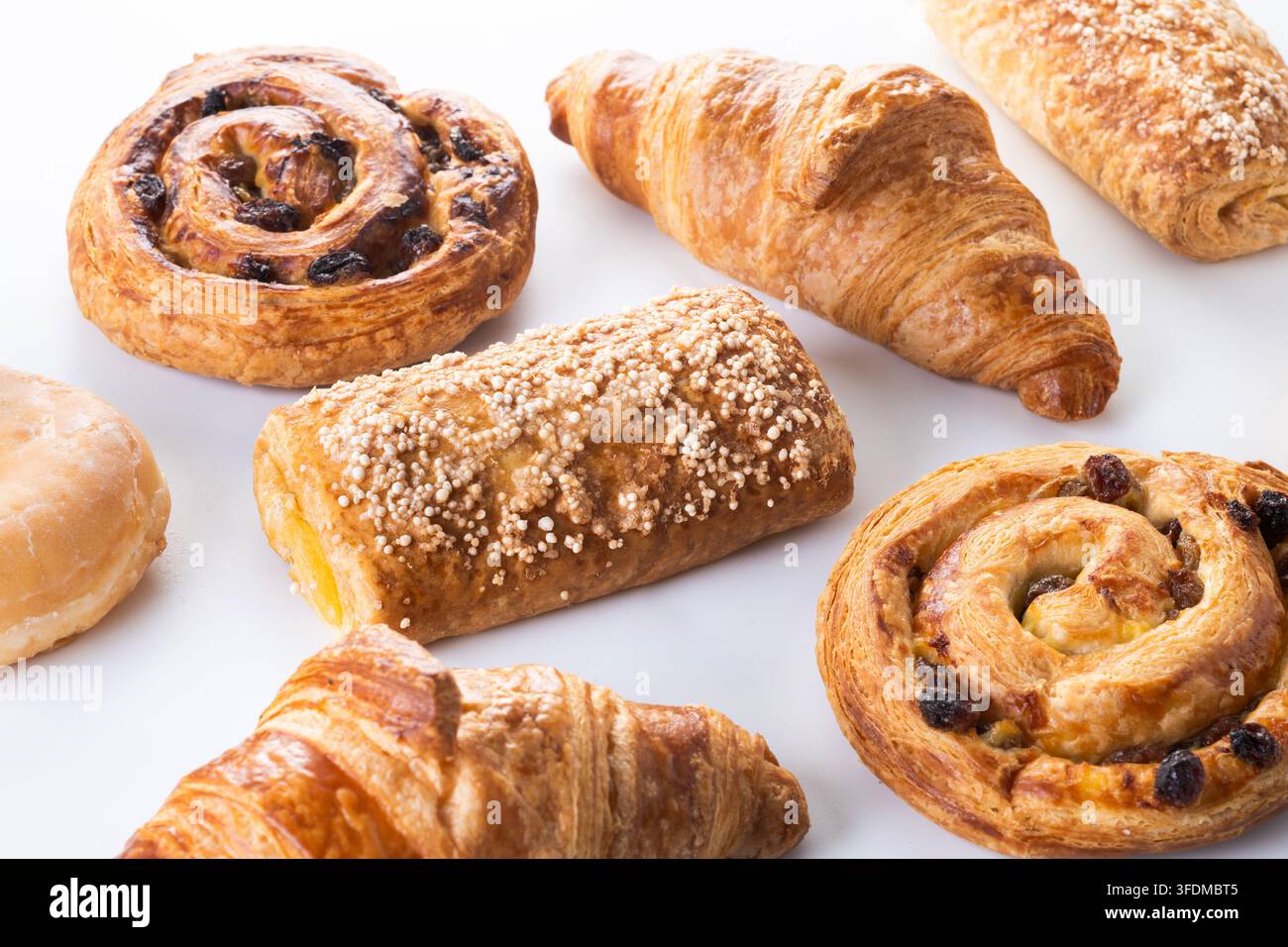 Assorted pastries and donuts isolated on white background Stock Photo