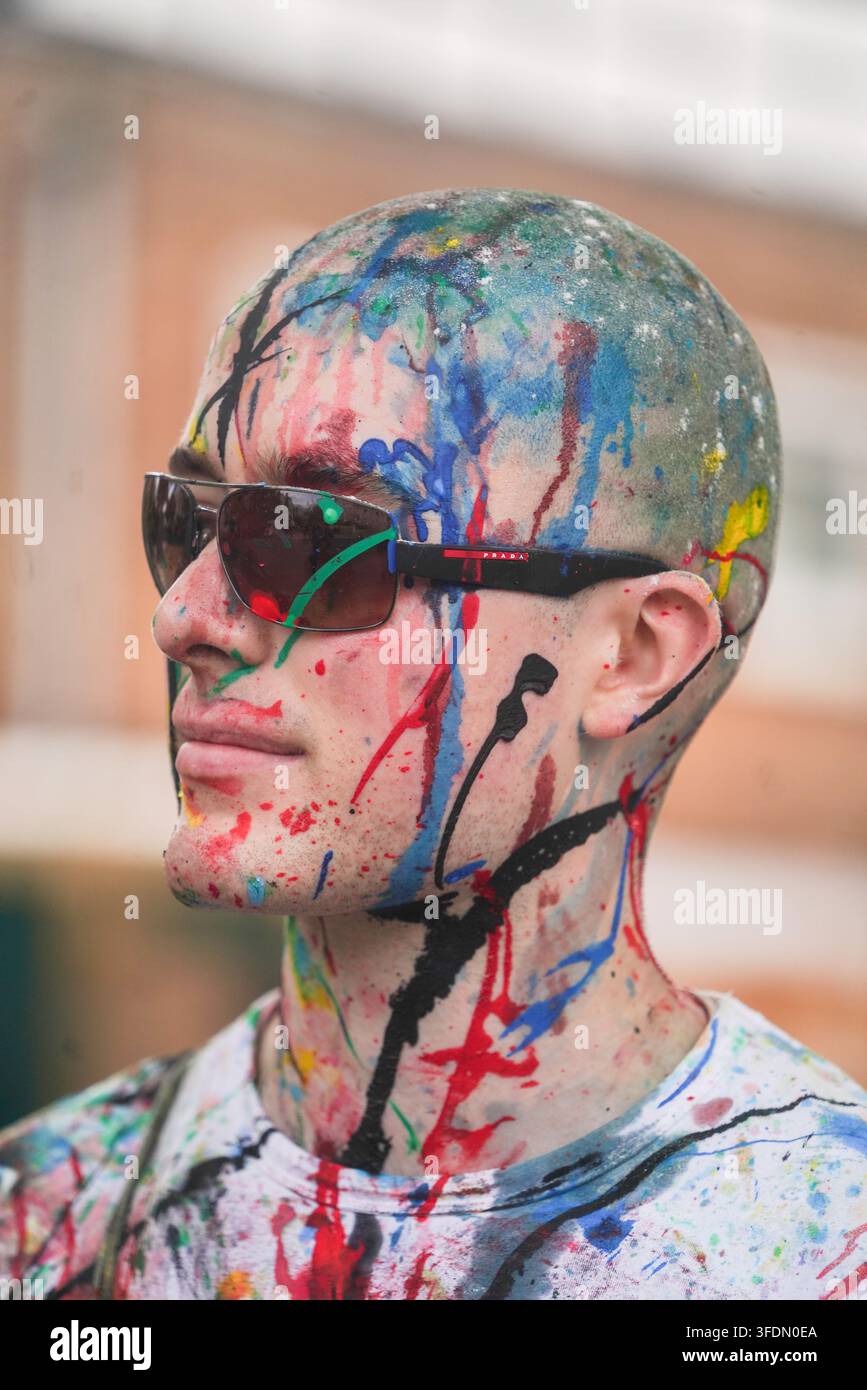 close-up-of-a-man-s-face-covered-in-coloured-paint-stock-photo-alamy