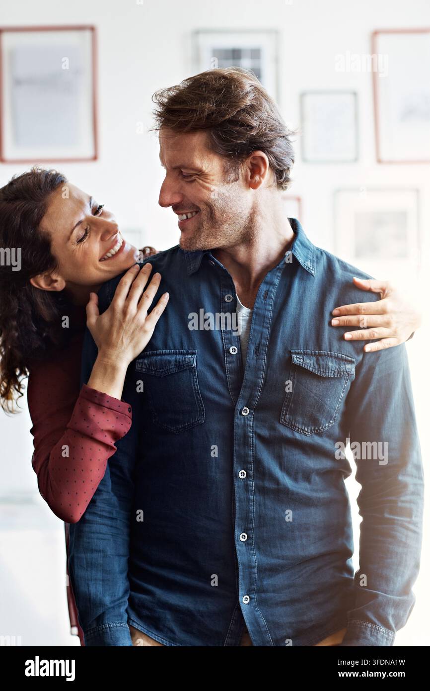 smile-love-and-hug-with-couple-in-home-for-bonding-connection-and