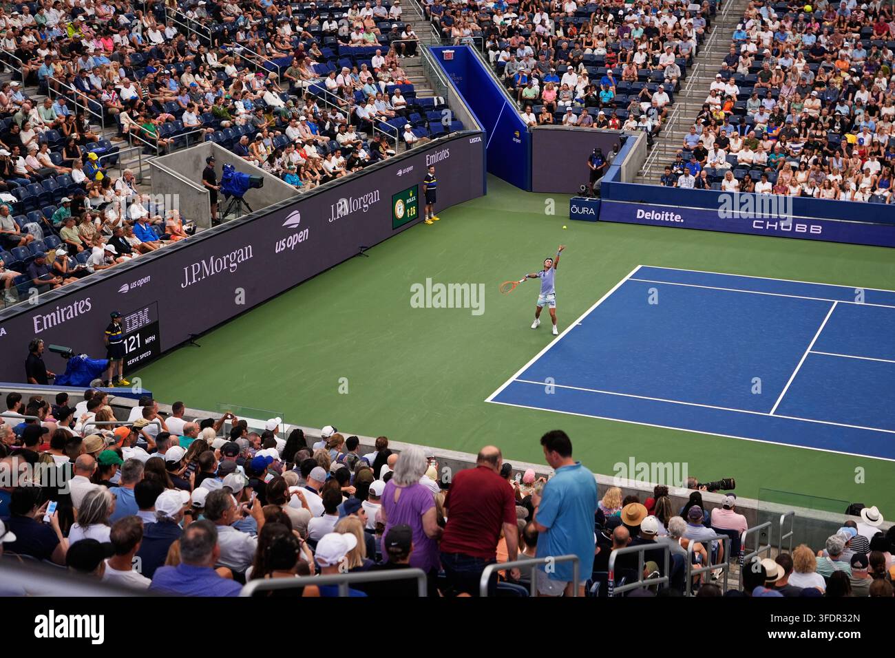 Francisco Comesana, of Argentina, serves to Flavio Cobolli, of Italy ...
