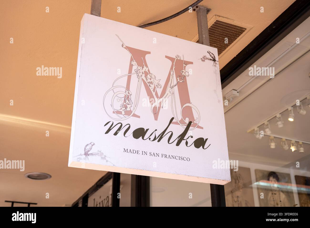 Textual Image File Hanging Mashka sign with decorative logo and text reading Made in San ...