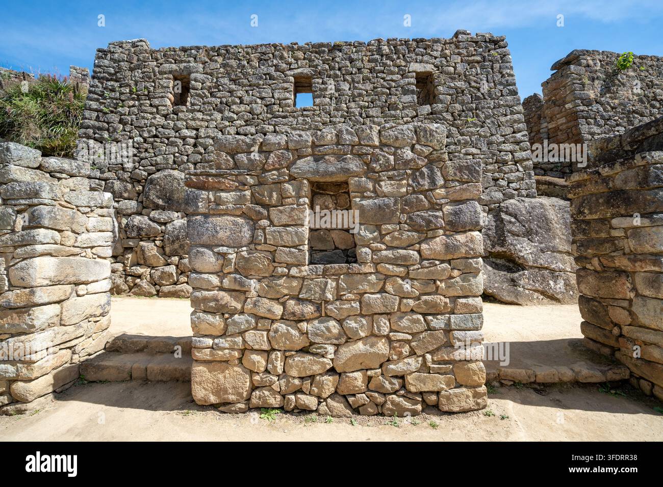 Ancient Inca stone walls and narrow window openings at Machu Picchu ...