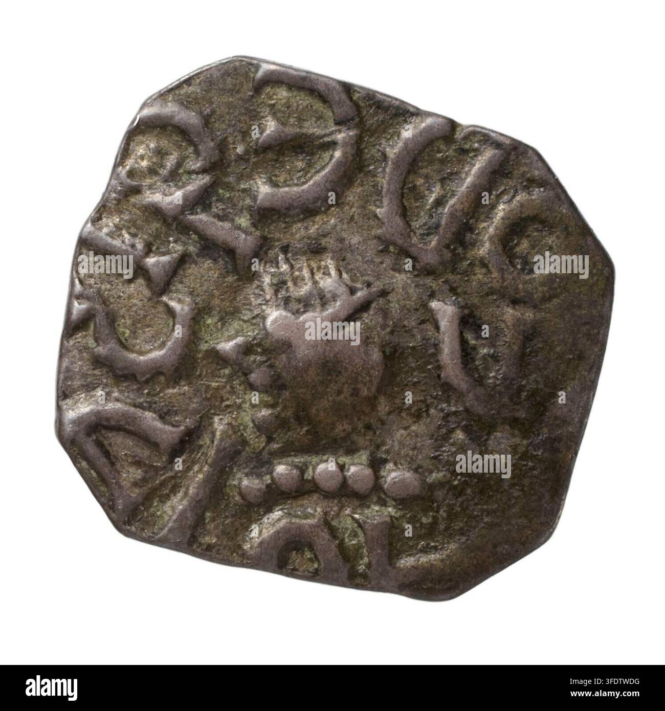 An ancient coin featuring a stylized animal head and raised symbols ...