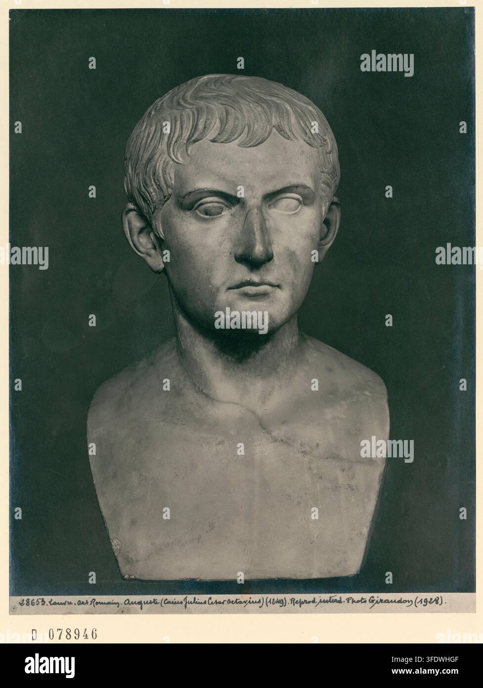 A marble bust of Auguste, Roman Emperor, depicted from the chest up ...