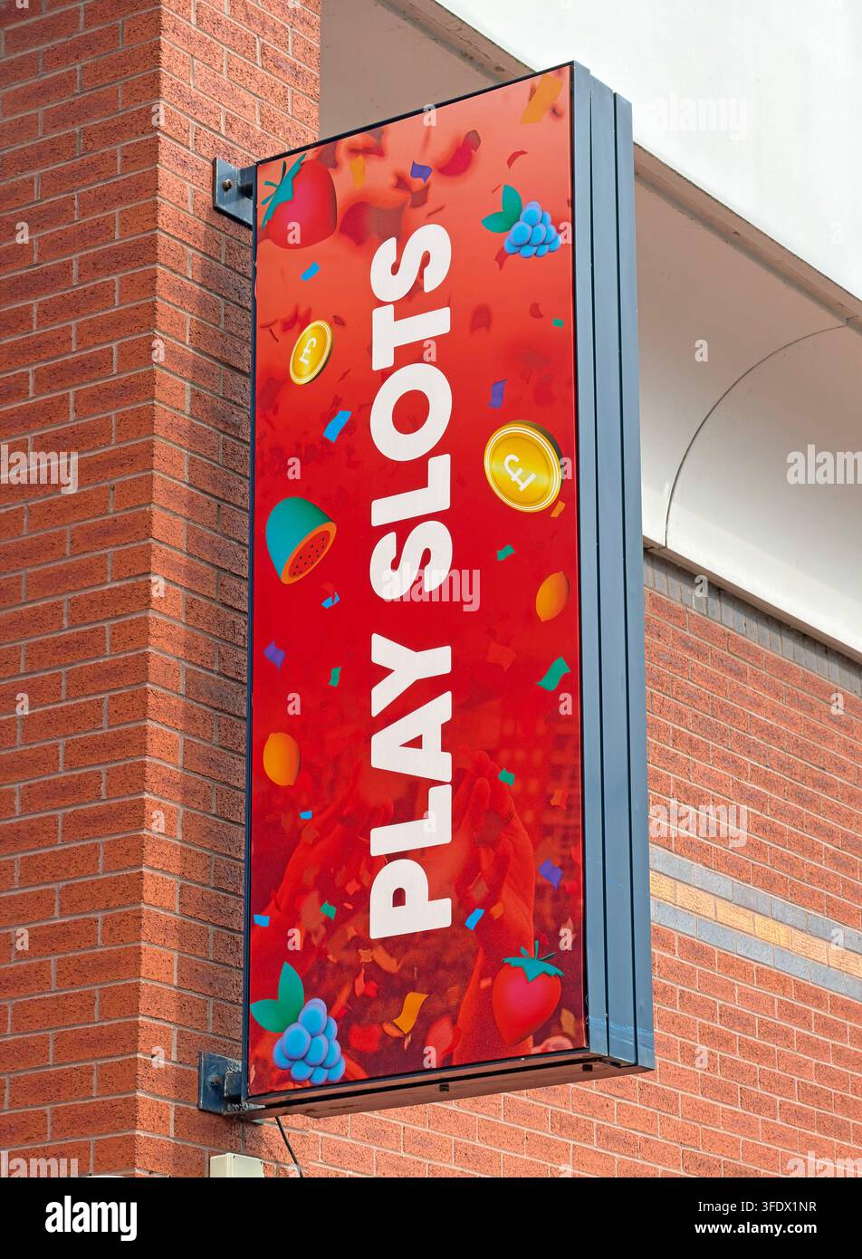 Play Slots sign outside Buzz Bingo at Cockhedge Centre, Warrington, promoting gaming machines Stock Photo