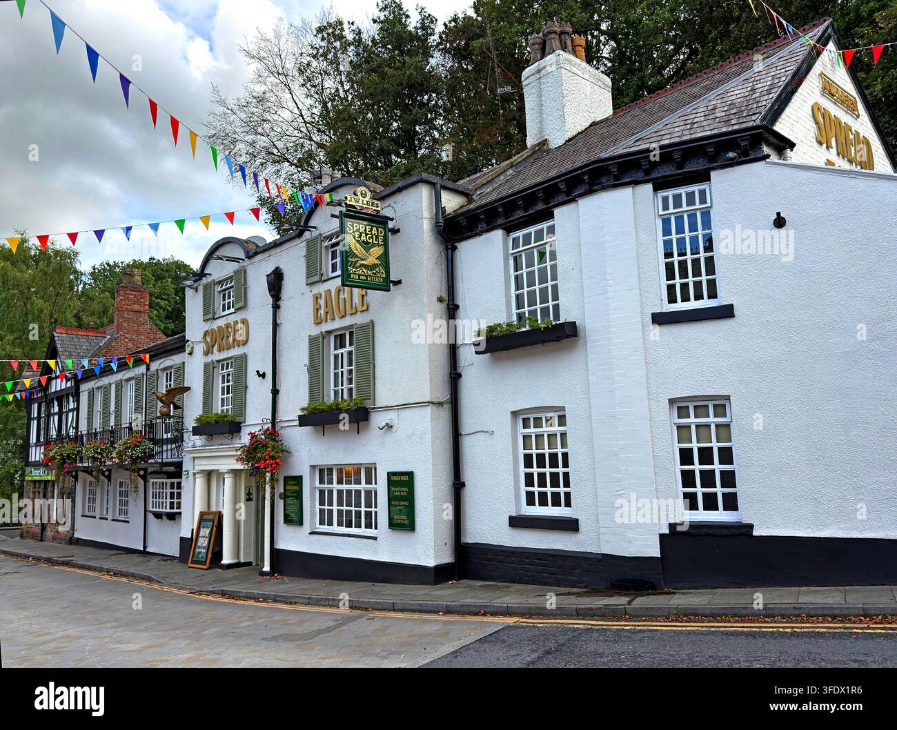 The Spread Eagle pub in Lymm village, a traditional JW Lees public house serving cask and real ale Stock Photo