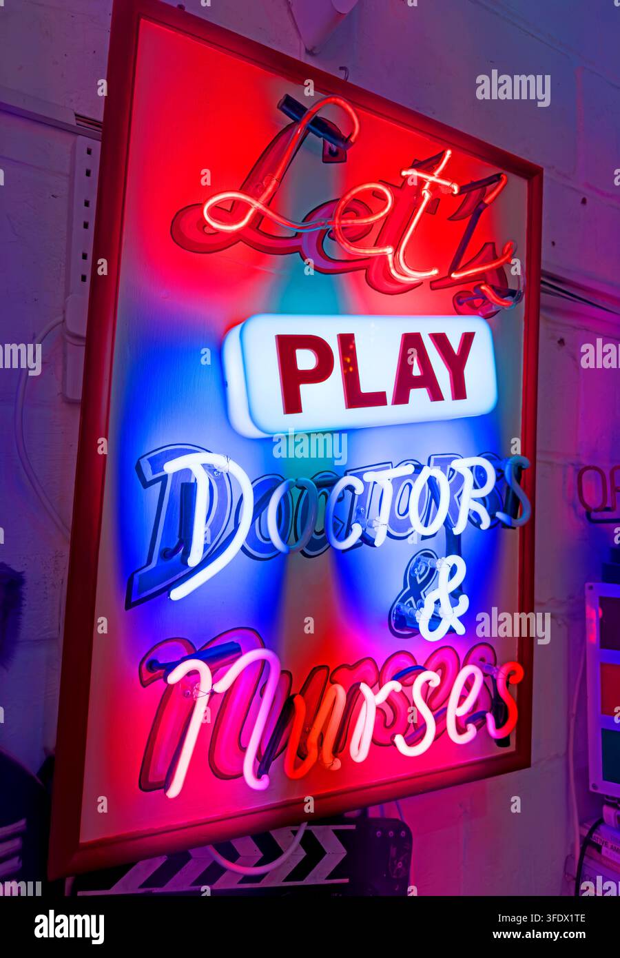 Doctors and nurses fetish roleplay neon sign, using medical imagery and playful NHS associations Stock Photo