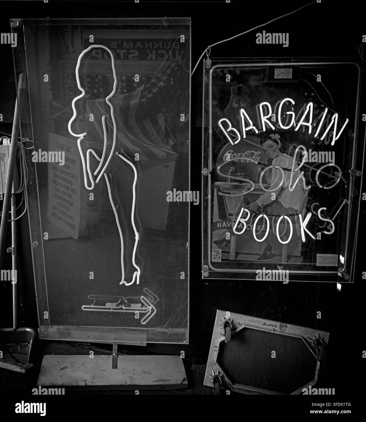 Vintage-style Bargain Books sign and female outline at a Soho adult premises in black and white, London Stock Photo
