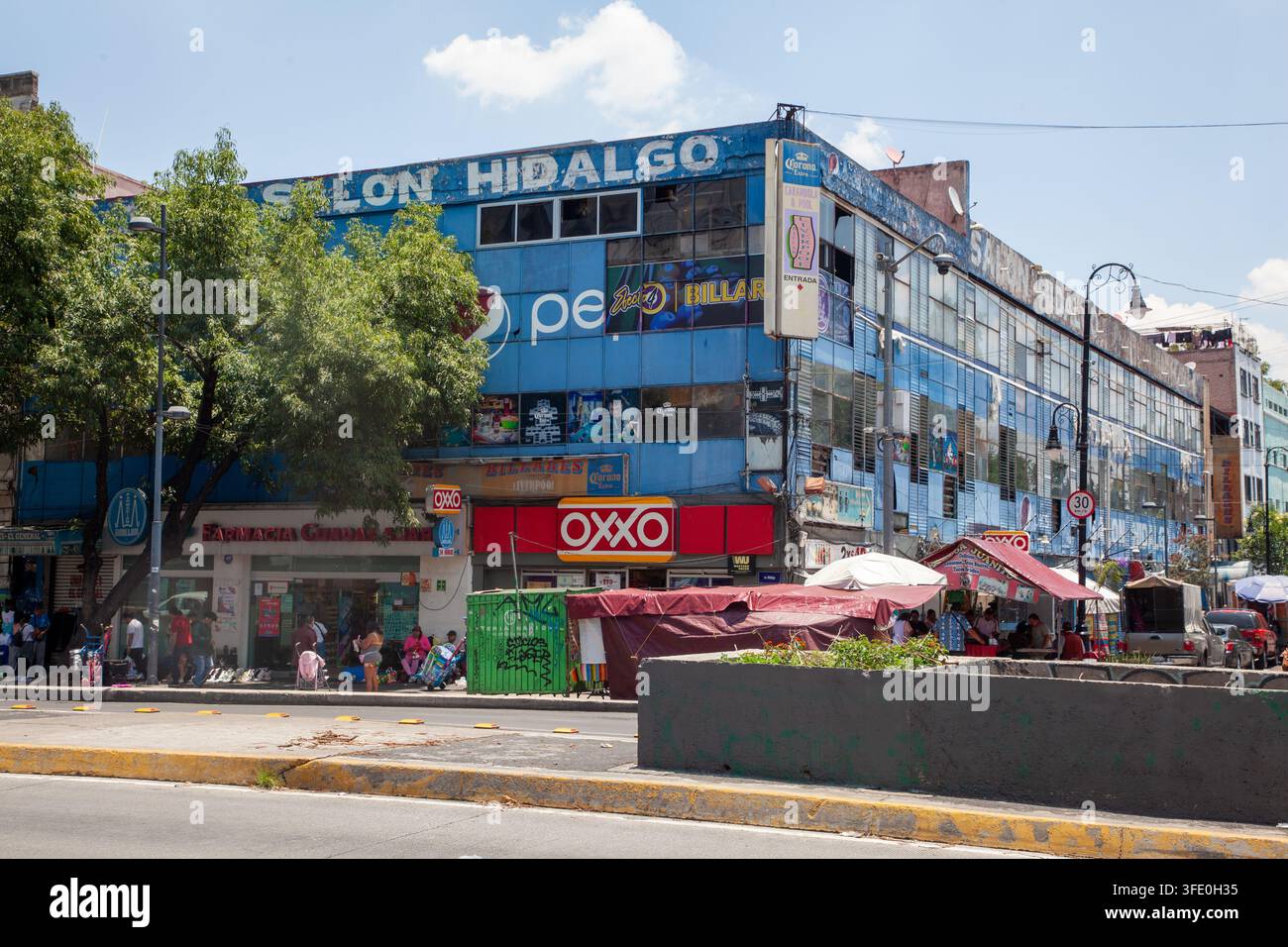 commercial building featuring the Salón Hidalgo sign on its upper facade, located at Avenida Hidalgo 115 in the historic Colonia Guerrero, CDMX Stock Photo