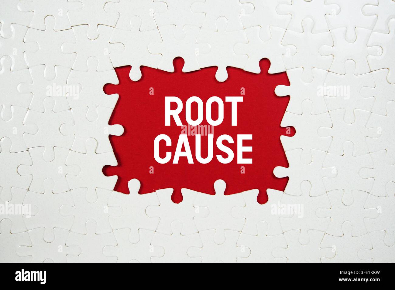 Jigsaw puzzle with a missing piece with "Root Cause" on red background Stock Photo