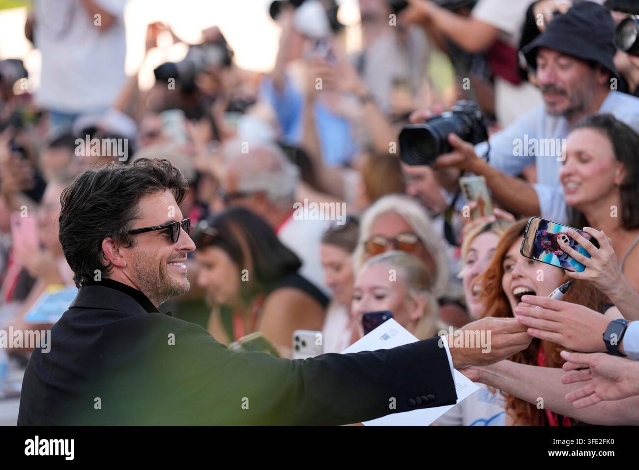 Jonathan Bailey Signs Autographs At The Opening Ceremony And The Red jonathan-bailey-signs-autographs-at-the-opening-ceremony-and-the-red