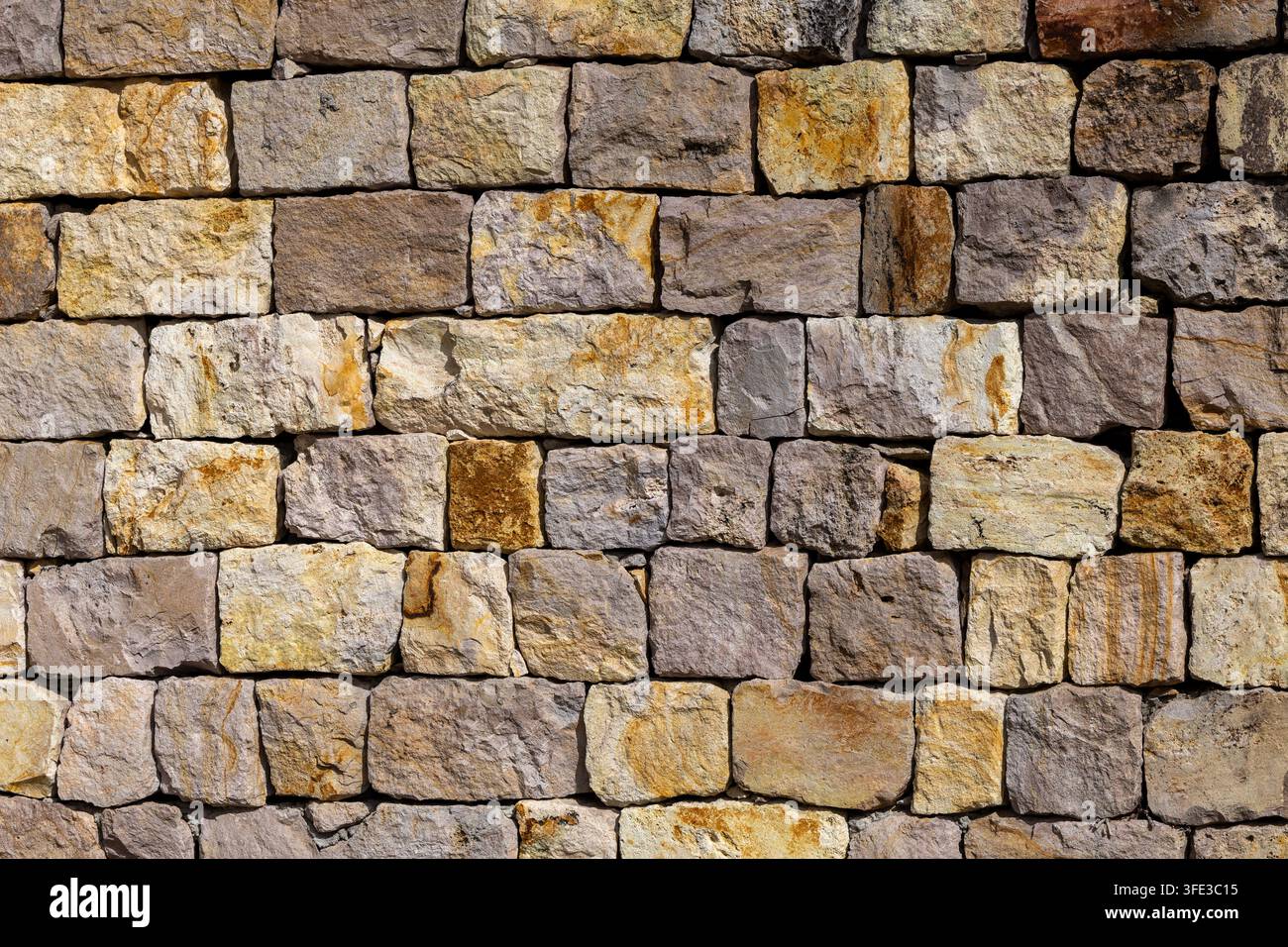 Old rustic stone wall texture background Stock Photo