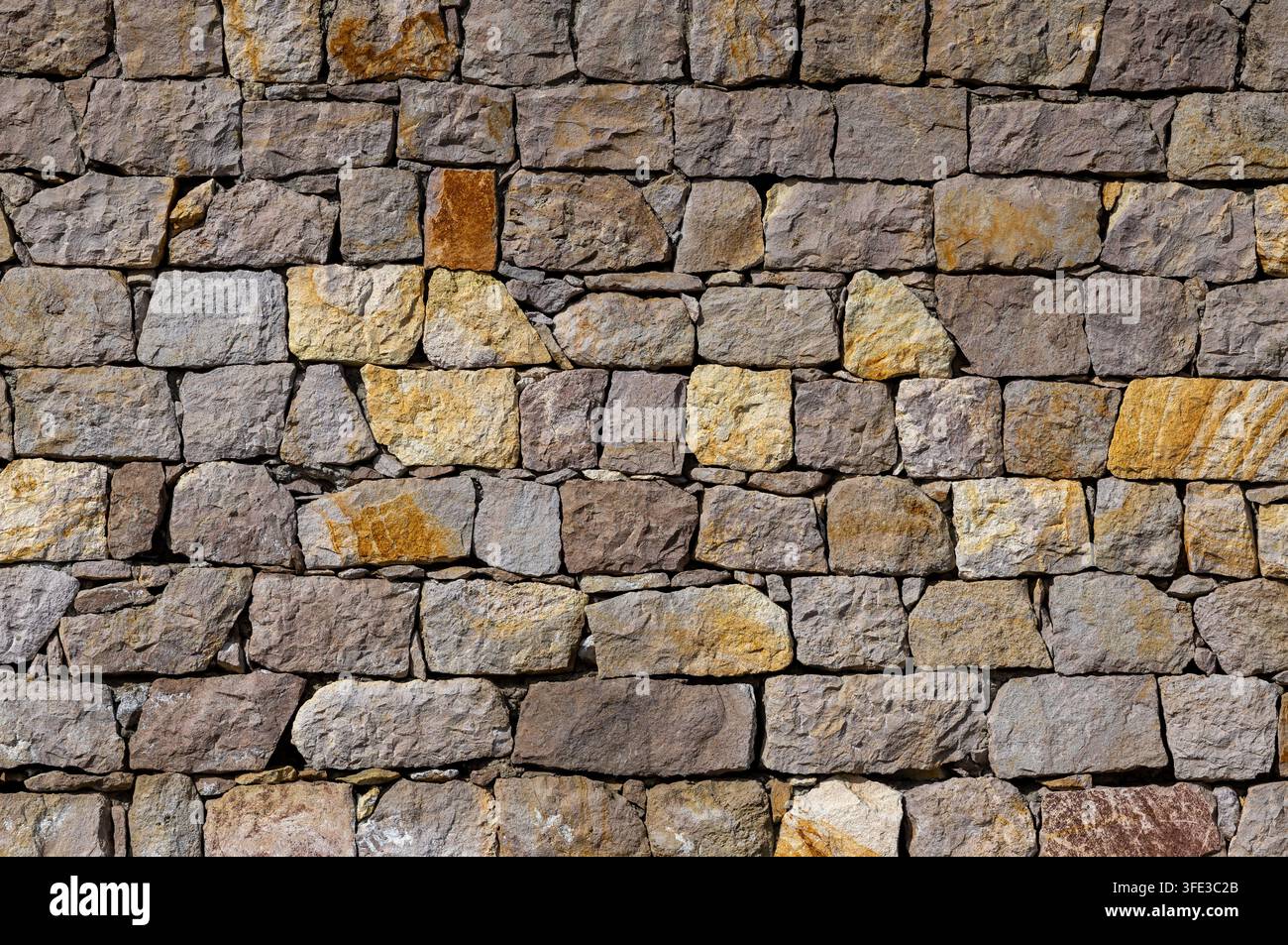 Old rustic stone wall texture background Stock Photo
