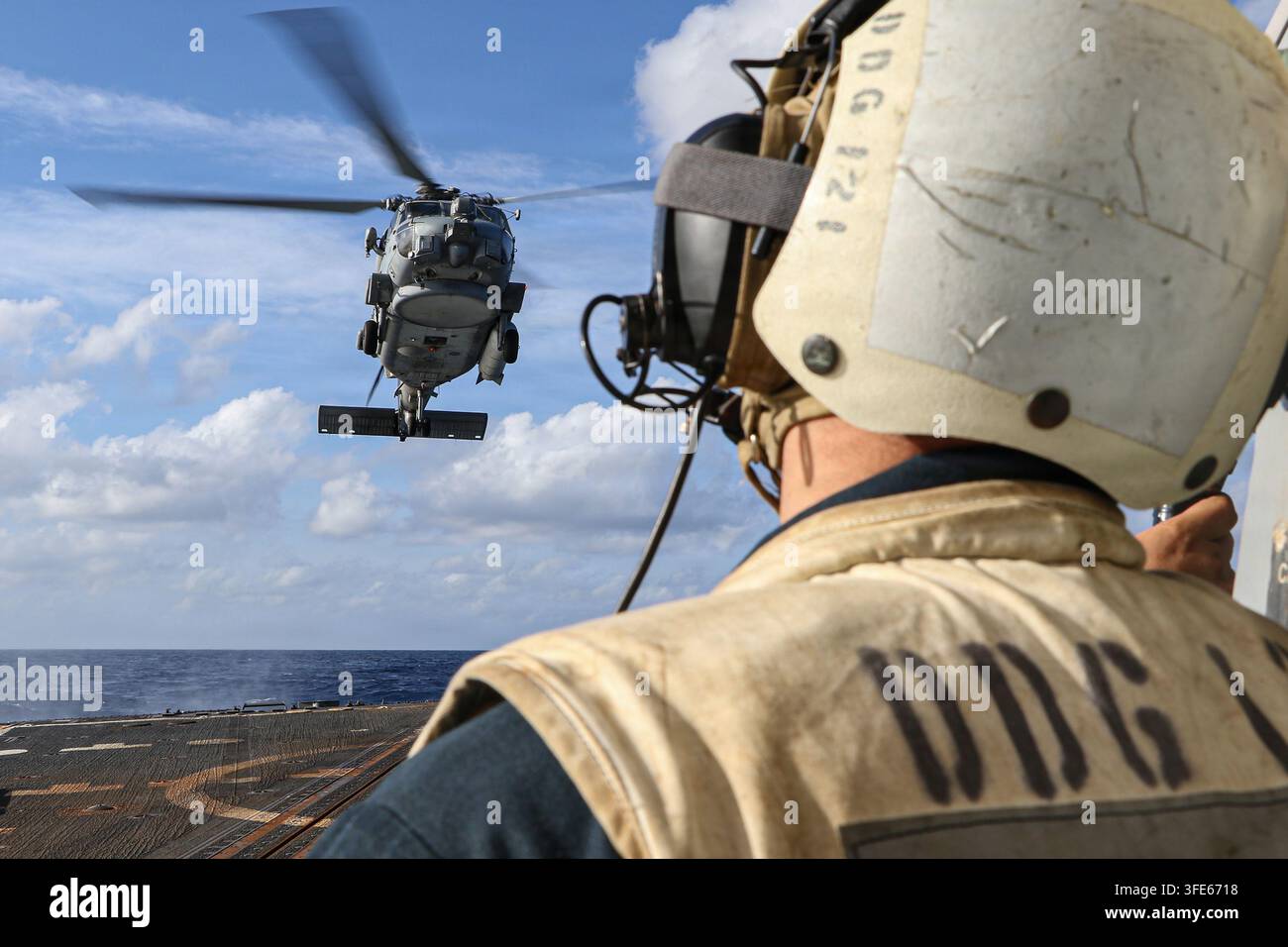 U.S. Navy Boatswain’s Mate 1st Class Cory Reinstadtler observes as an ...
