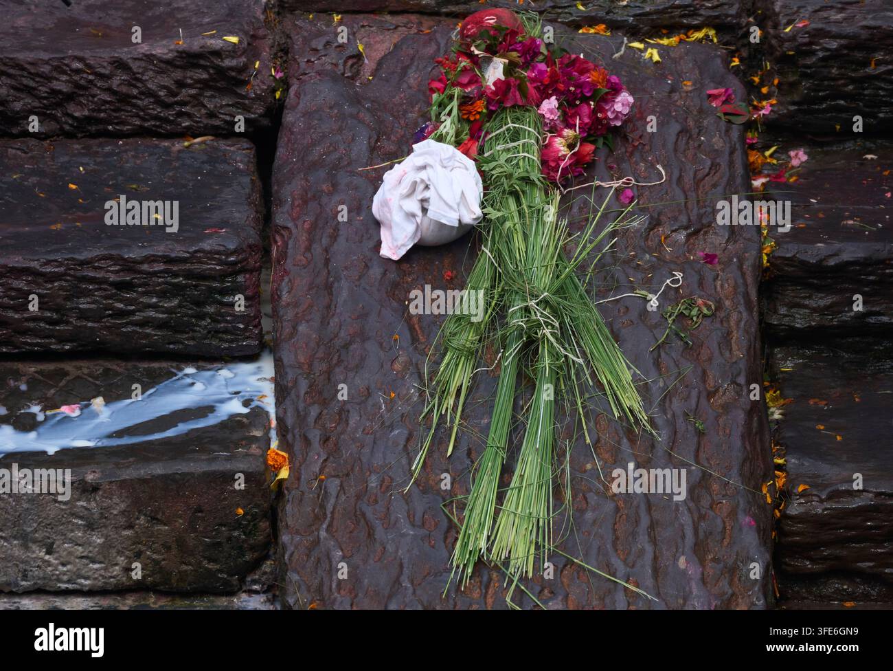 an-effigy-of-a-person-missing-in-the-deadly-flash-floods-is-placed-for