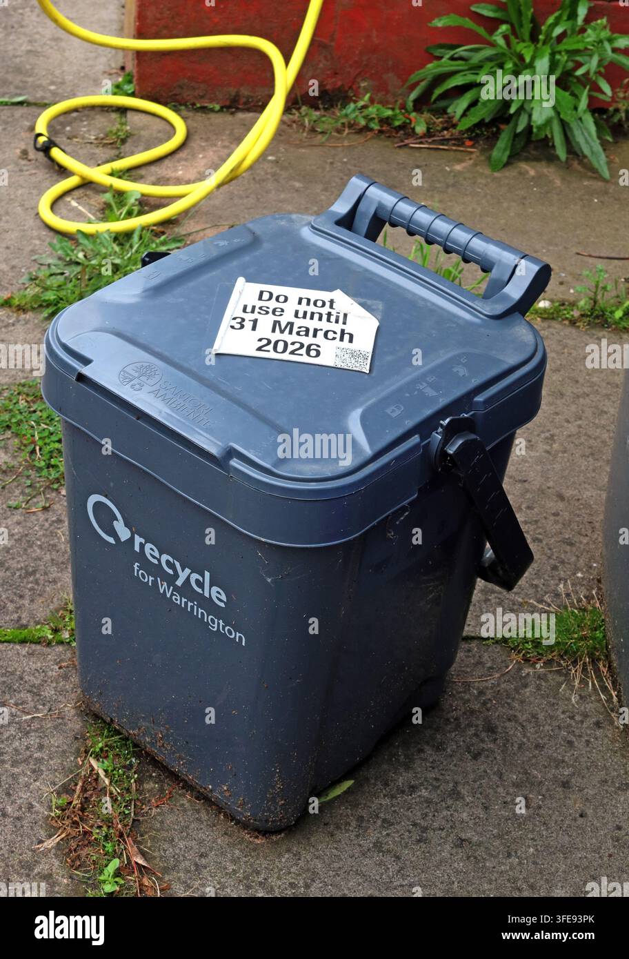 Grey food-waste recycling caddy in Warrington, part of England's Simpler Recycling reforms and debate over multiple household bins. Stock Photo