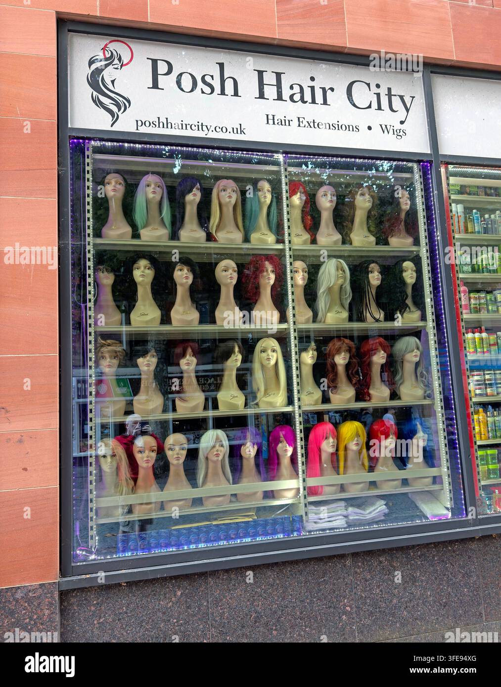 Posh Hair City wig and hairpiece display at Warrington Market, Cheshire, England, UK. Stock Photo
