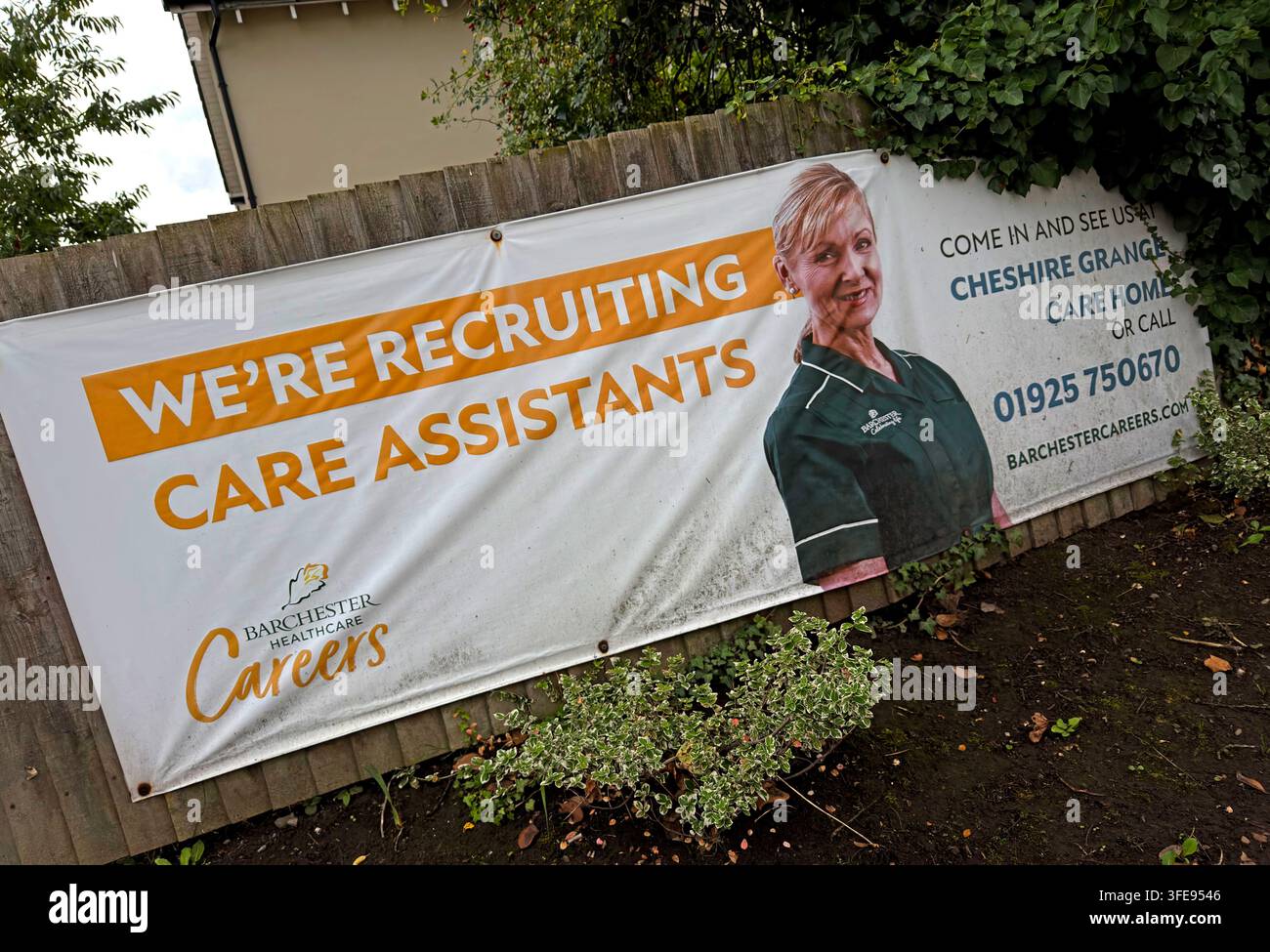 Care assistant recruitment banner at Cheshire Grange Care Home, Lymm, as Britain & Labour debates social care reform and staffing shortages Stock Photo
