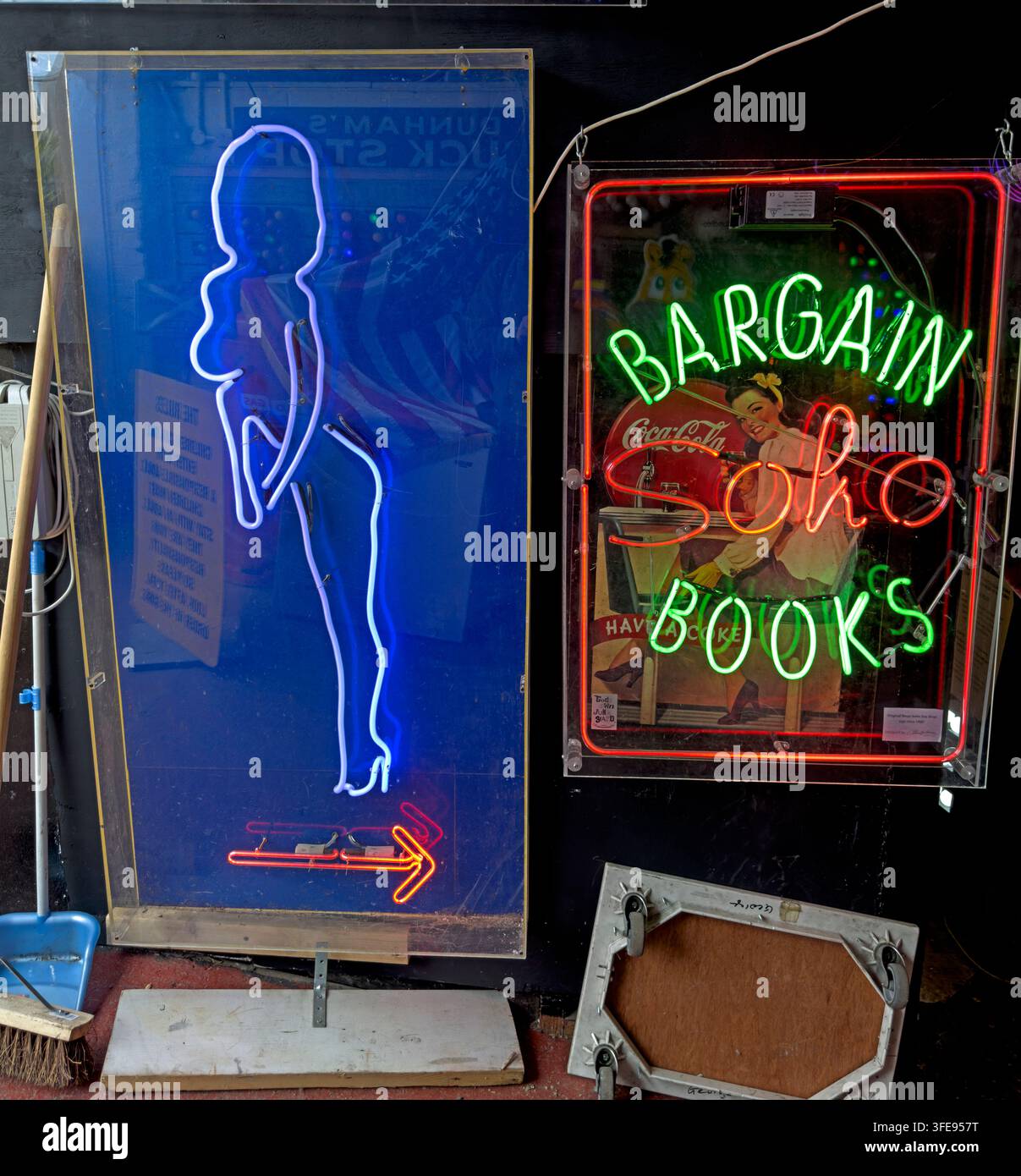 Bargain Books neon sign in Soho, London, part of the area's traditional adult-entertainment streetscape. Stock Photo