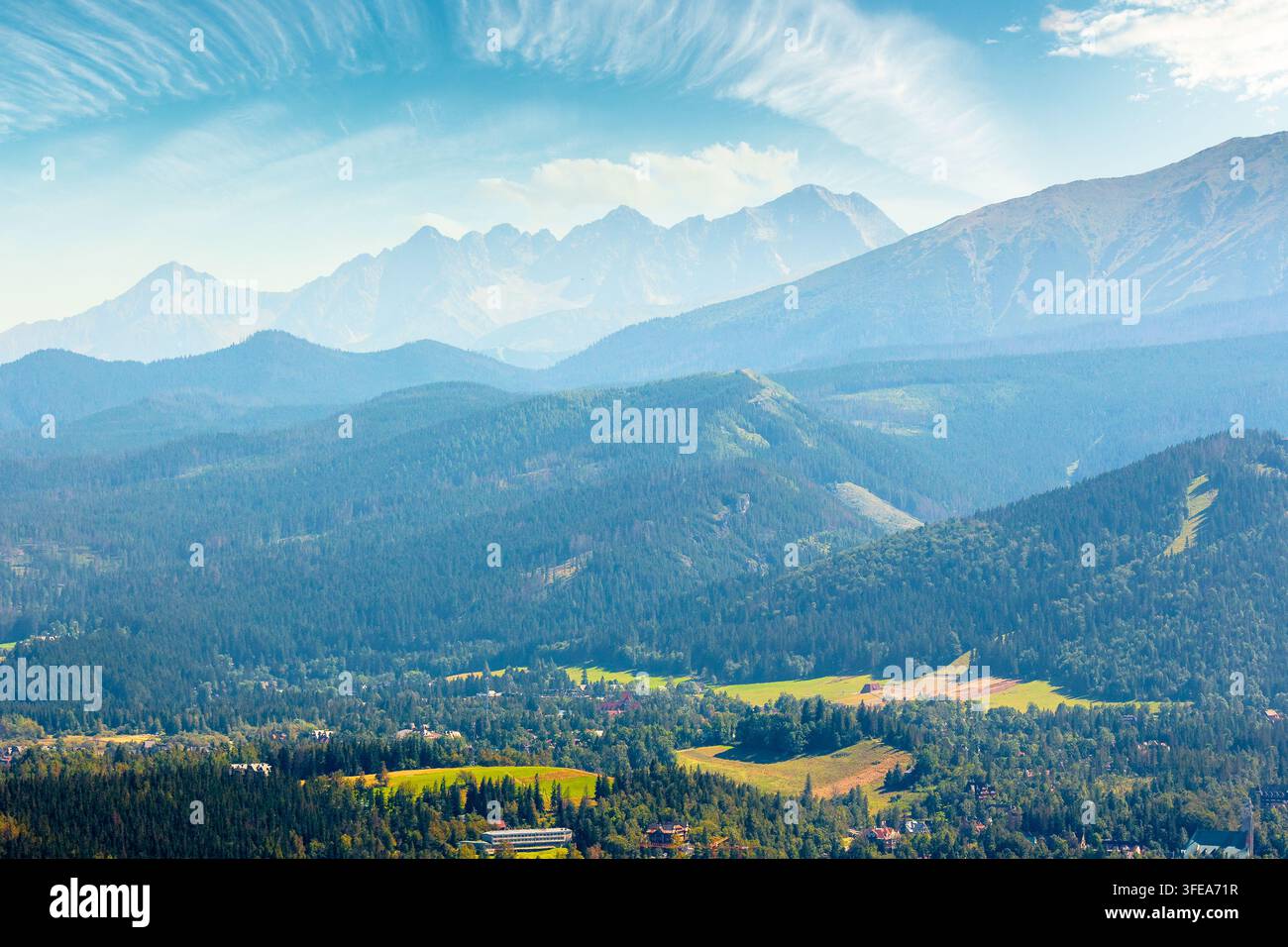 mountain landscape of Poland in late summertime. wonderful view of High Tatra ridge above Zakopane village valley. vacation place in Europe Stock Photo