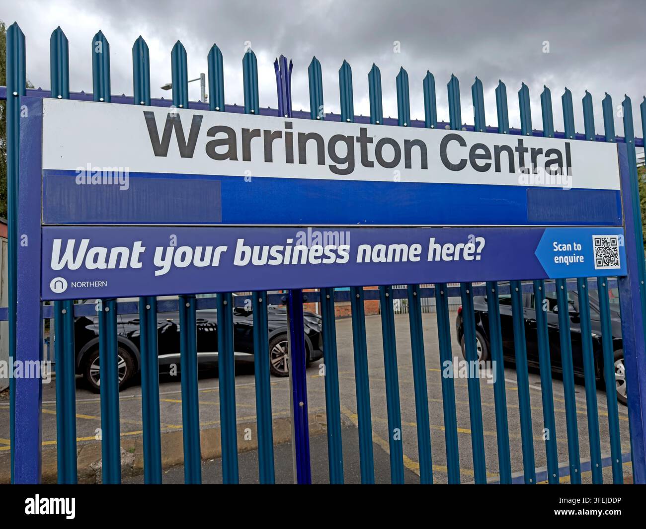 Advertising space on the railings at Warrington Central railway station, Cheshire. Stock Photo