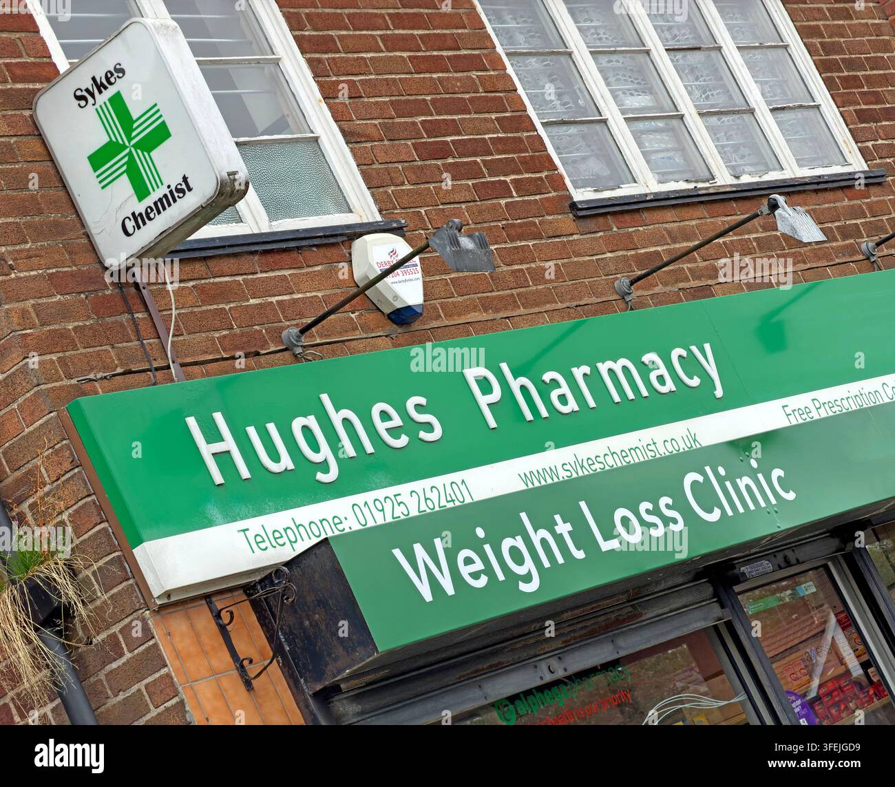 Hughes Pharmacy in Grappenhall advertising a weight loss clinic and private health ( GLP-1 ) services. Stock Photo