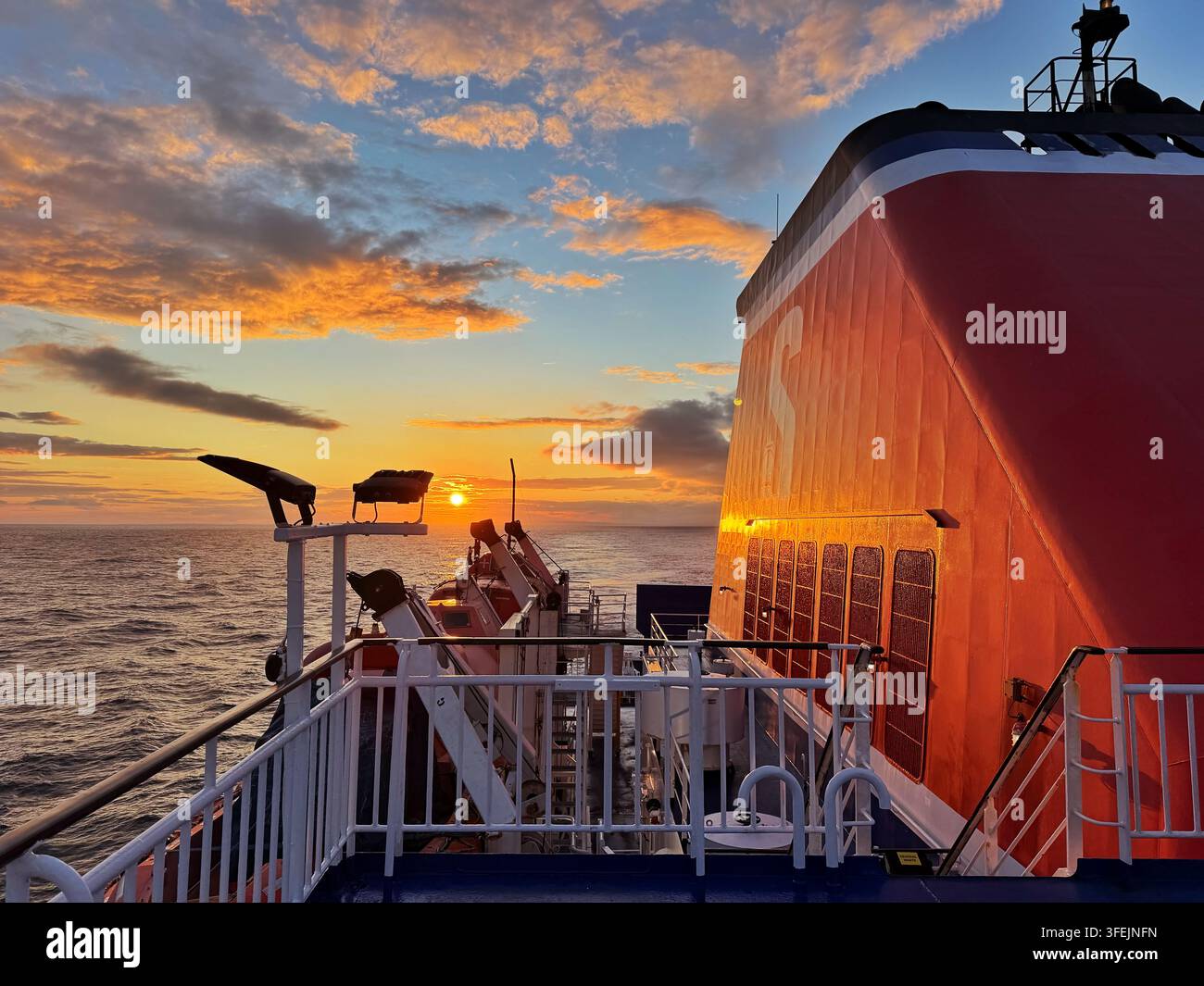 Sunset as seen from a Stena line ferry leaving Rosslare for Fishguard. - Smartphone Captured Stock Image