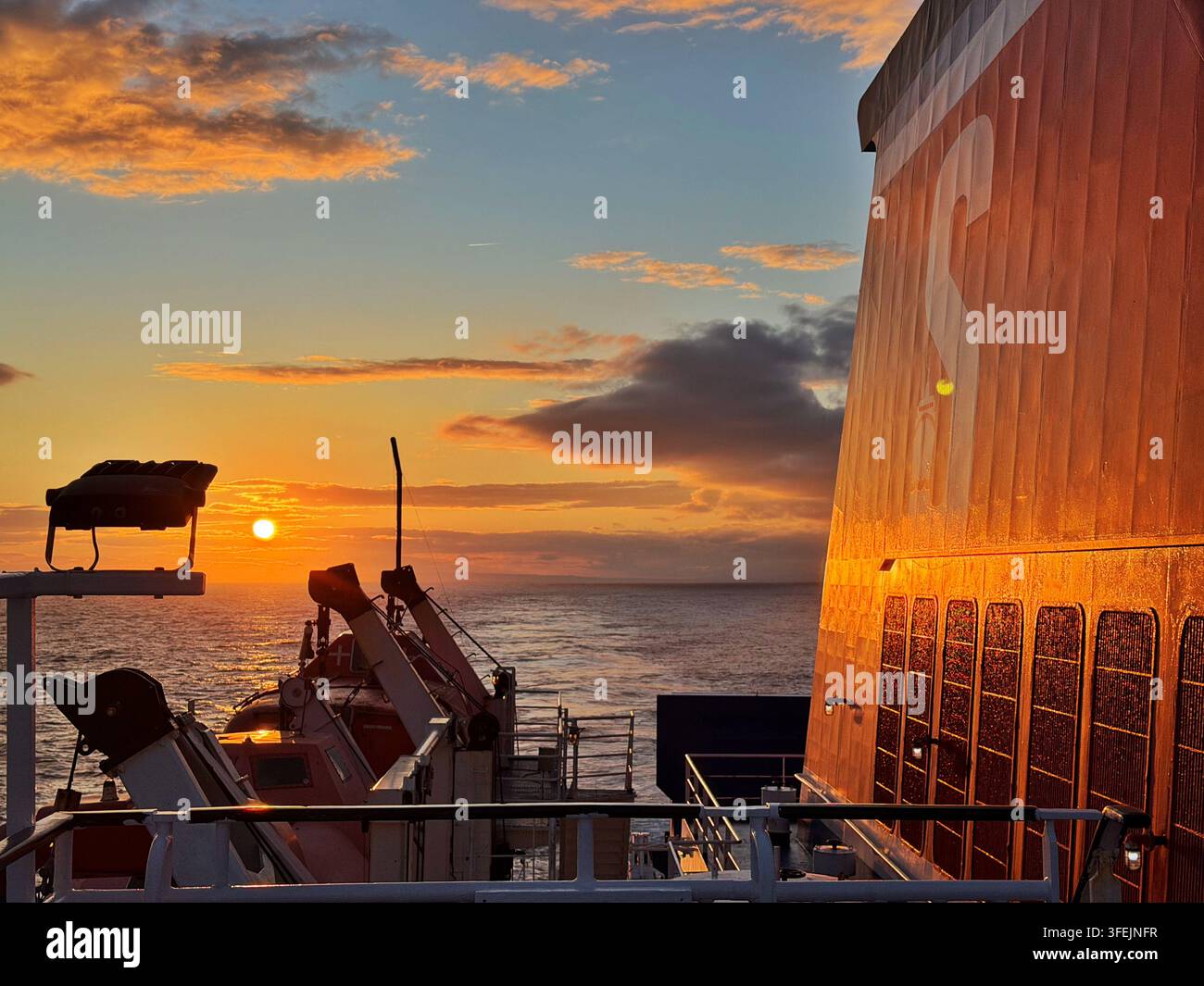 Sunset as seen from a Stena line ferry leaving Rosslare for Fishguard. - Smartphone Captured Stock Image