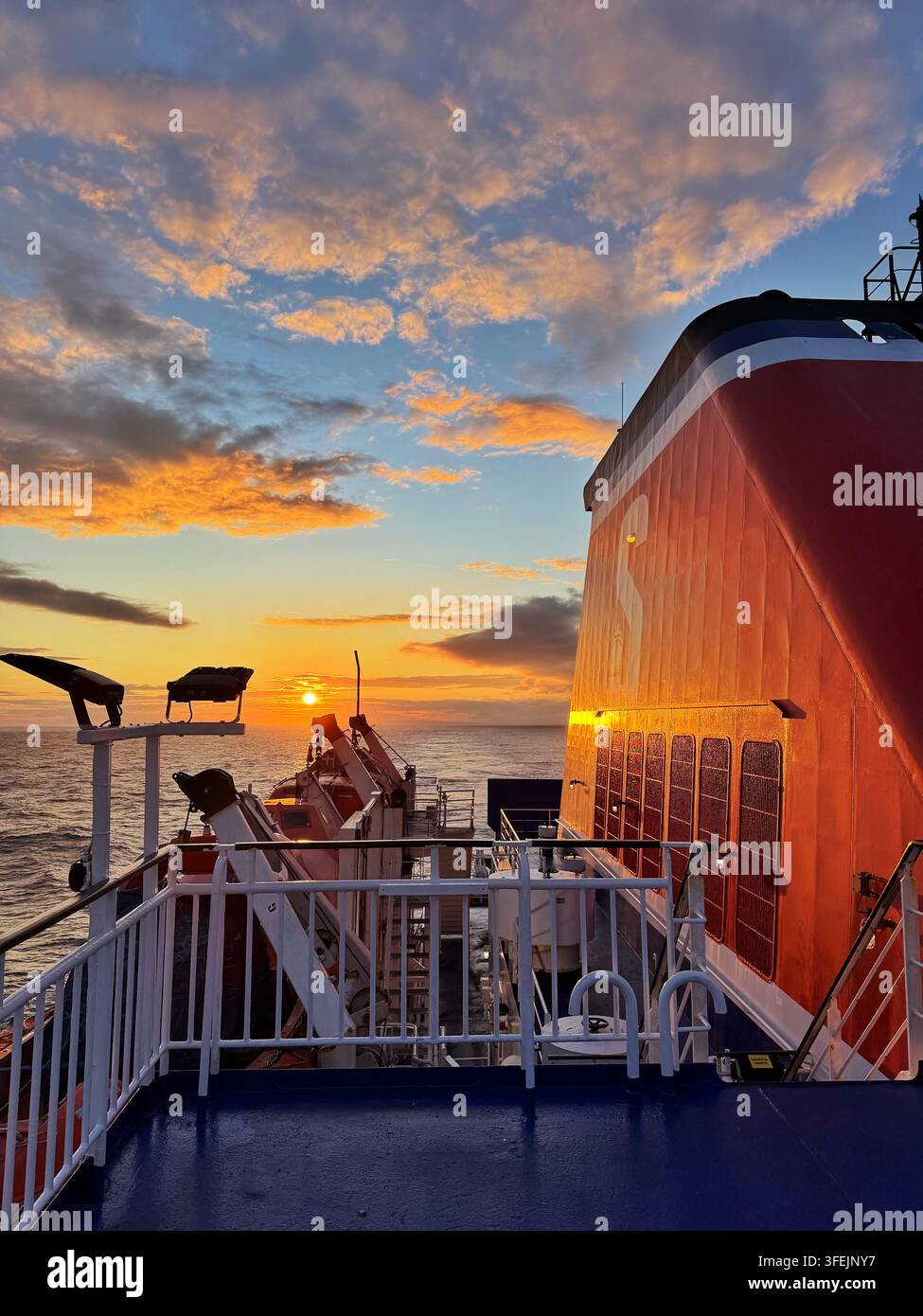 Sunset as seen from a Stena line ferry leaving Rosslare for Fishguard. - Smartphone Captured Stock Image