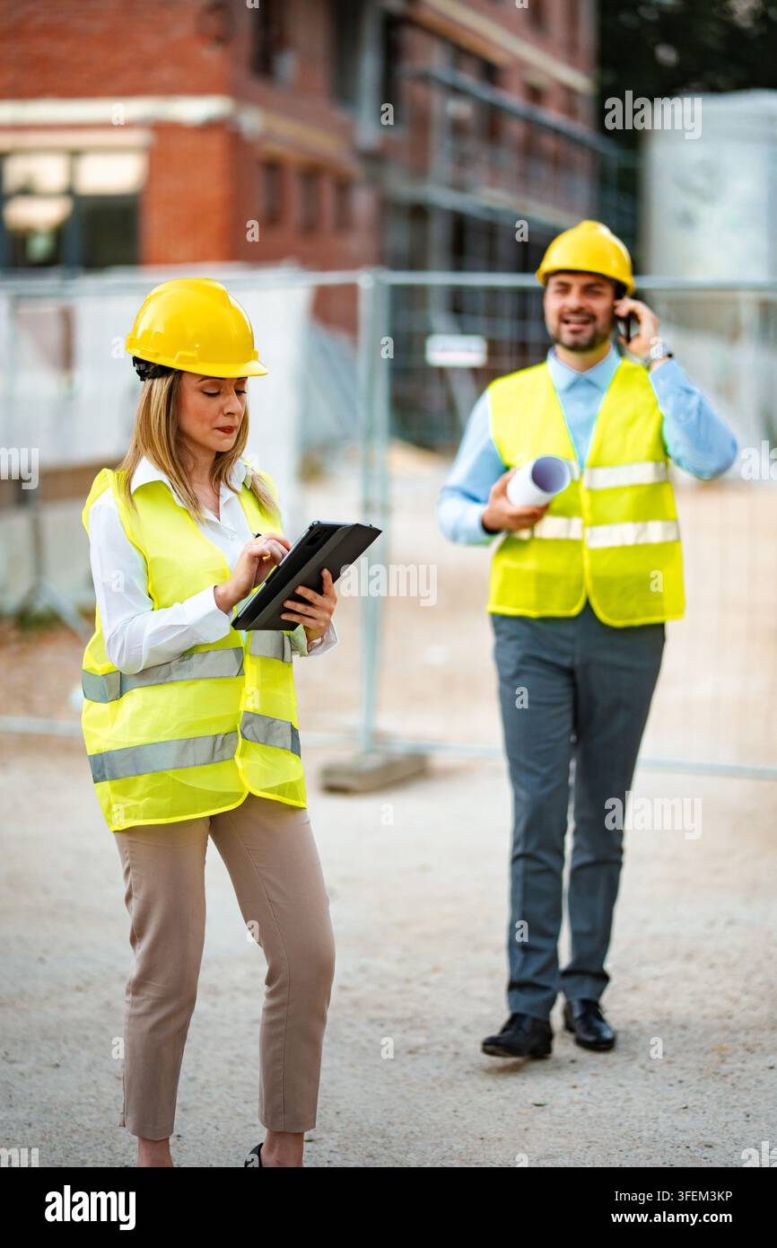Engineers working on construction site planning new project Stock Photo