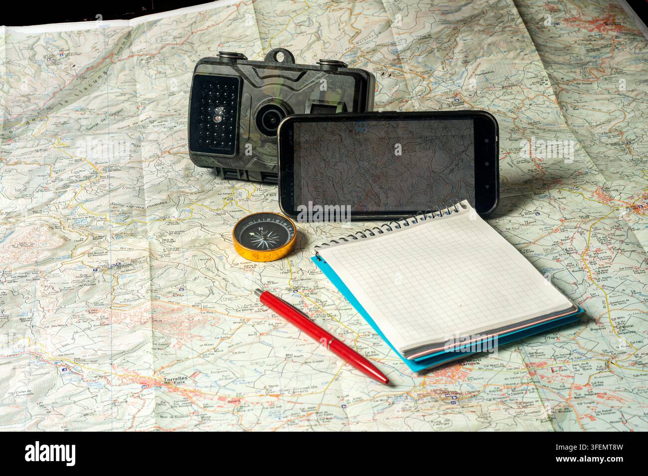 Planning outdoor adventure using map and navigation tools Stock Photo