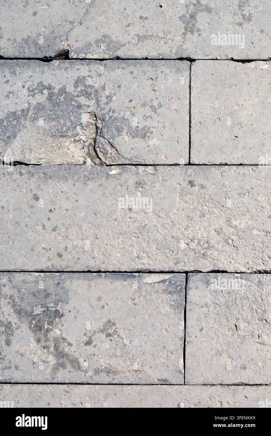 Weathered Gray Limestone Block Wall Texture with Natural Stone Surface Pattern Stock Photo