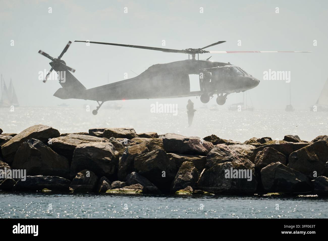 RCMP members jump out of a Black Hawk helicopter during a demonstration ...