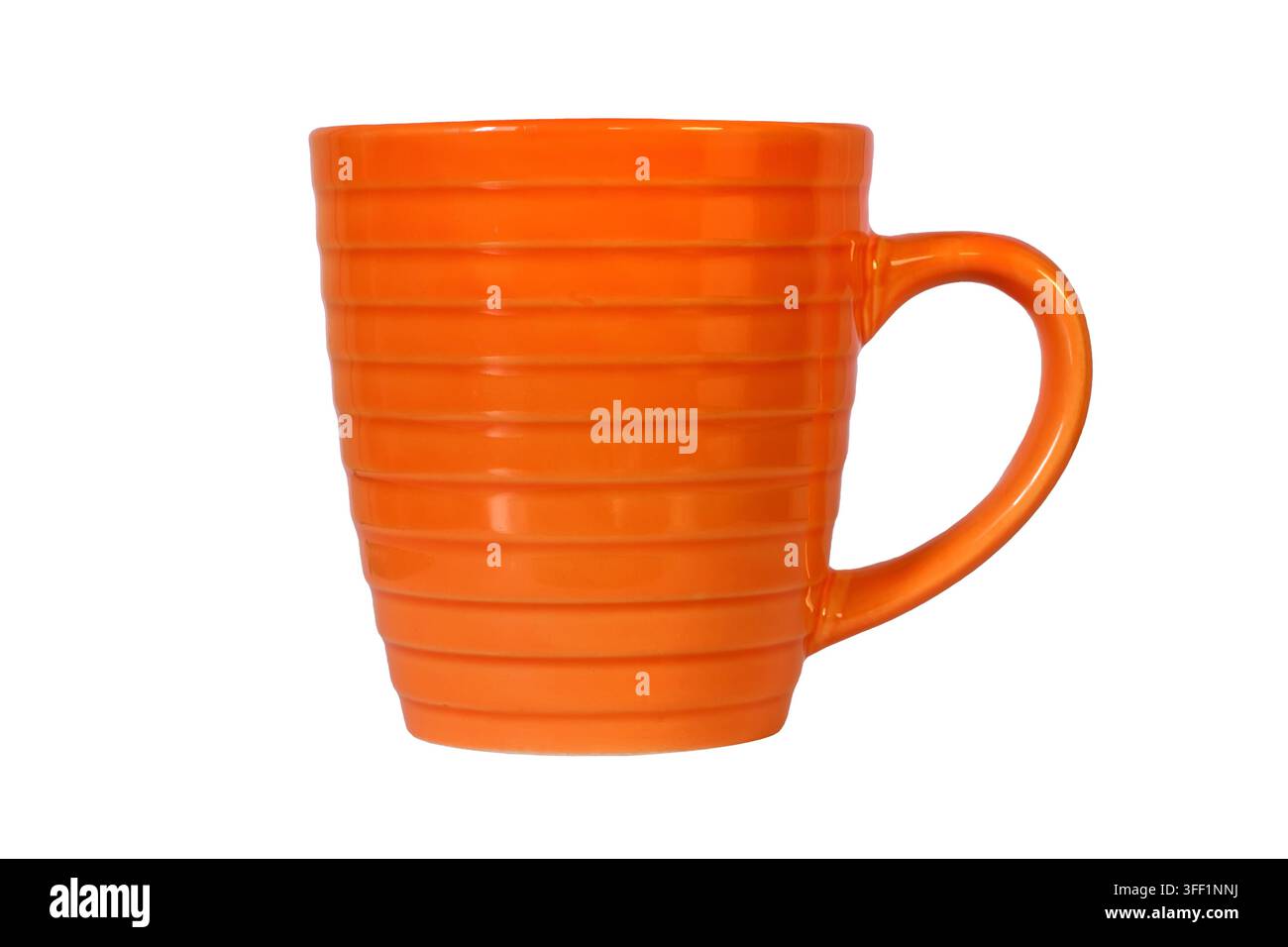Orange ceramic cup isolated on white background. Porcelain cup close-up Stock Photo