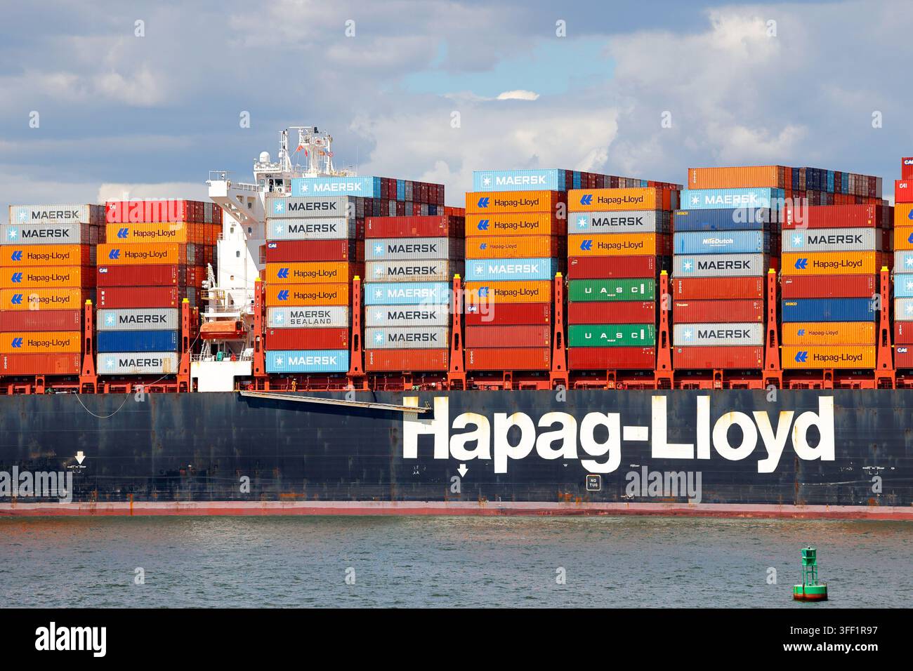 Cargo shipping containers onboard the Al Qiblad Express container ship operated by Hapag-Lloyd, a German shipping and transportation company. Stock Photo