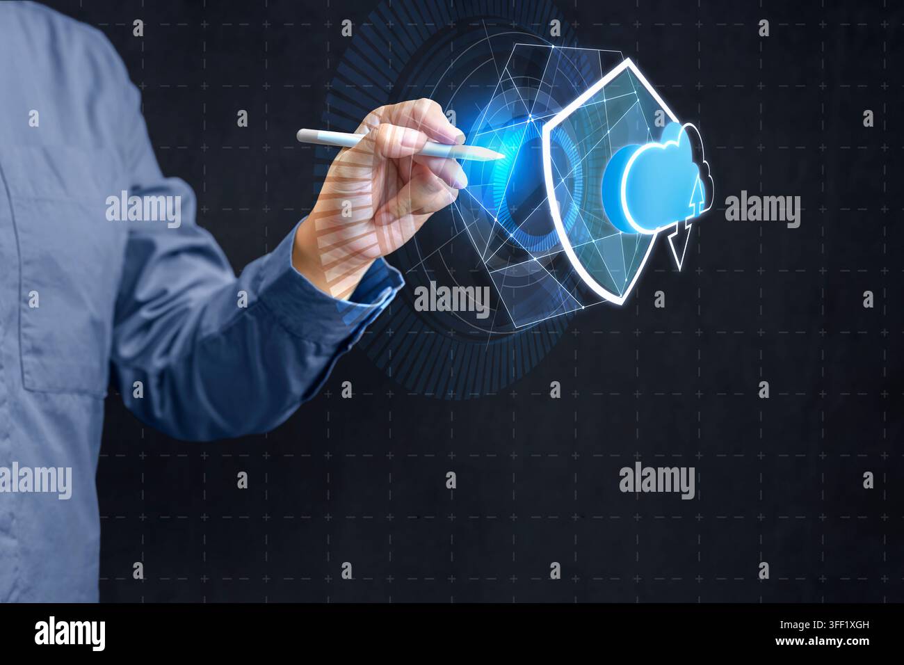 Businessman using stylus to interact with futuristic digital interface representing cloud computing security, featuring a glowing shield and cloud ico Stock Photo