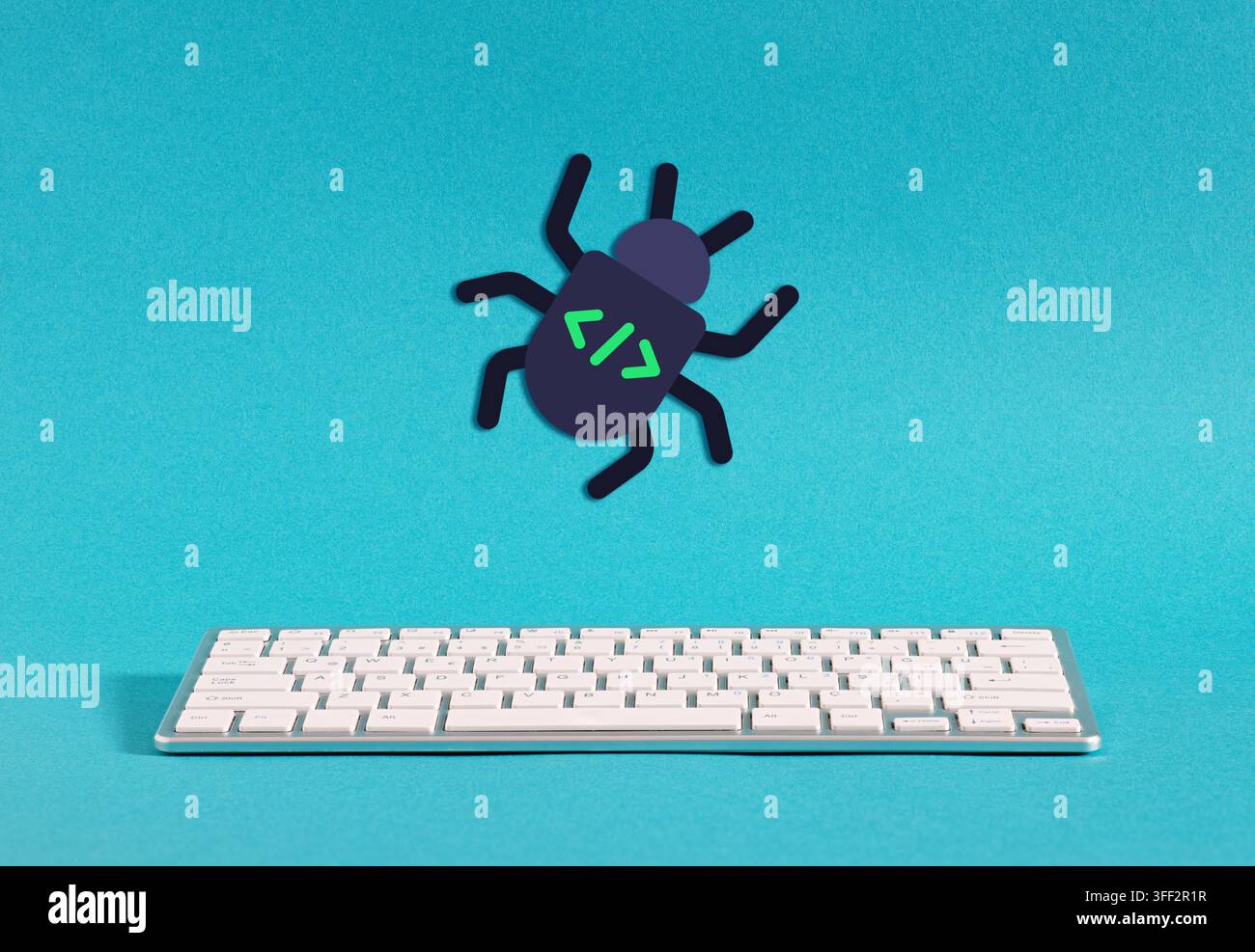 Programming bug icon hovering over a keyboard representing cybersecurity threats and code errors Stock Photo