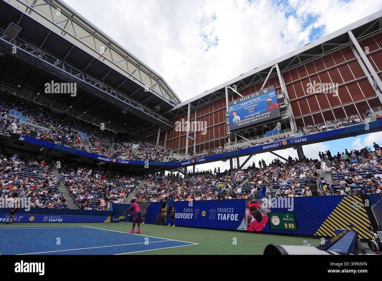 Frances Tiafoe, of the United States, serves to Daniil Medvedev, of