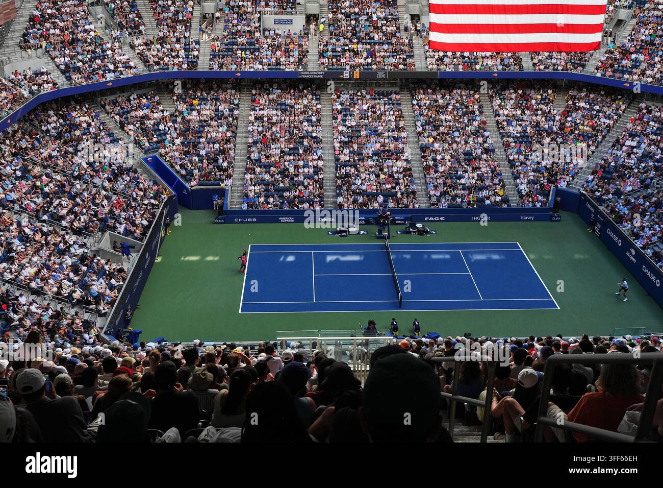Frances Tiafoe, of the United States, serves to Daniil Medvedev, of