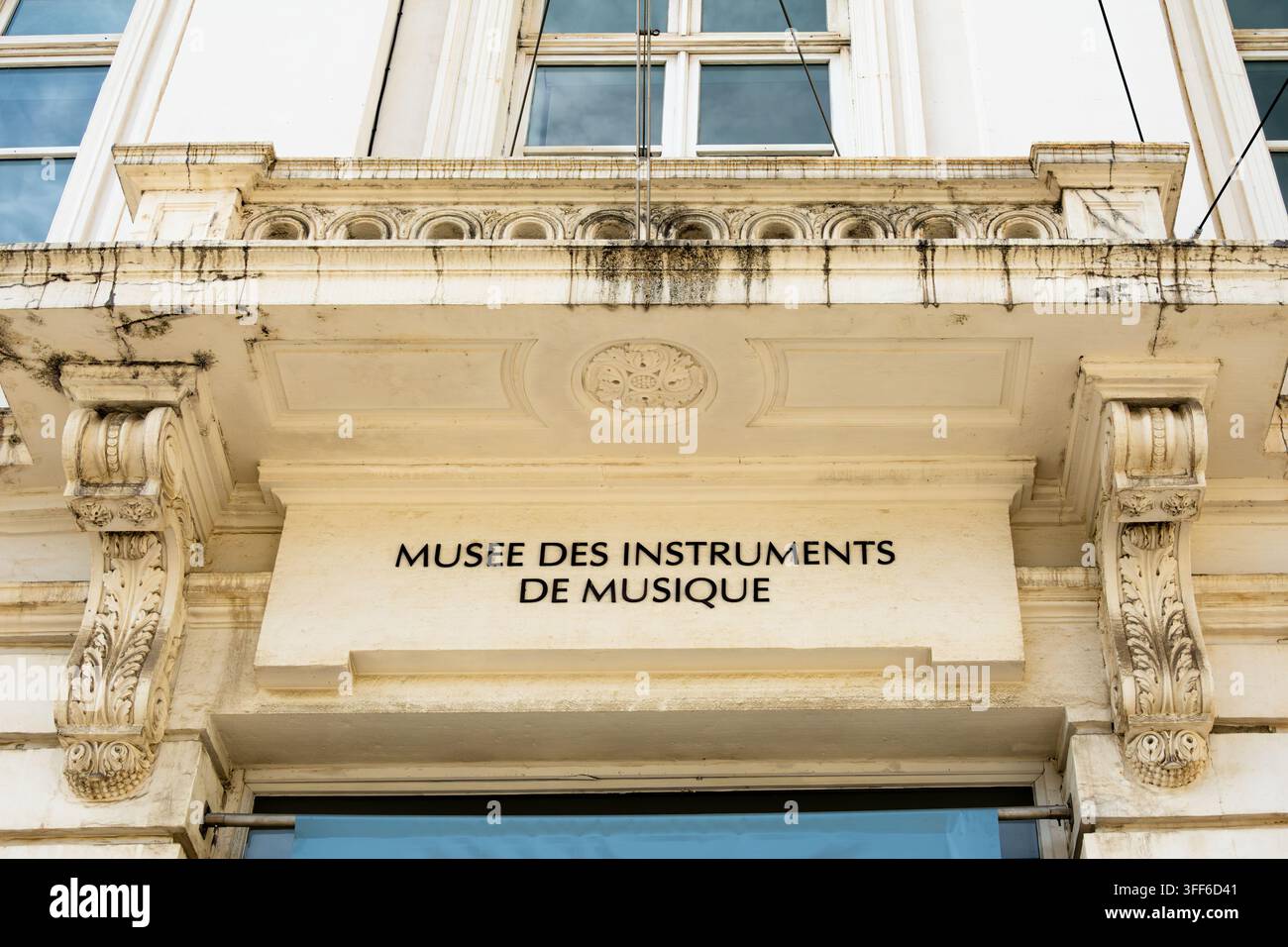 Brussels, Belgium - August 25, 2026: Facade of the Museum of Musical Instruments with carved stone details, tall windows, and French museum sign in a Stock Photo
