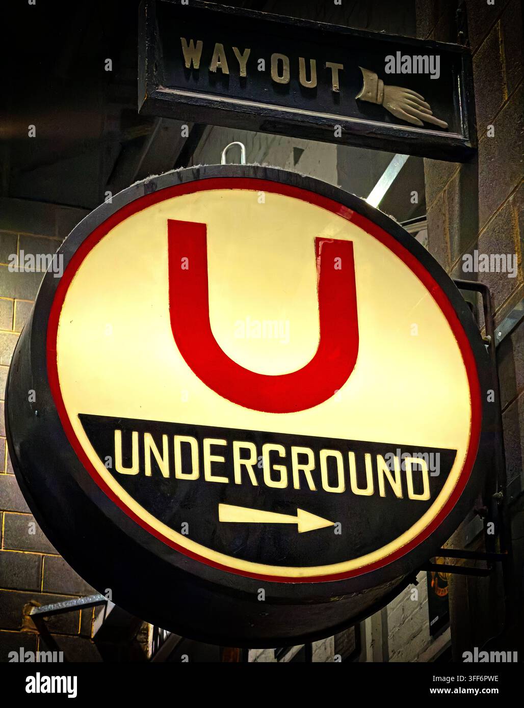 Historic London Underground roundel sign with red bar and blue lettering, an enduring symbol of the capital's transport network. Stock Photo