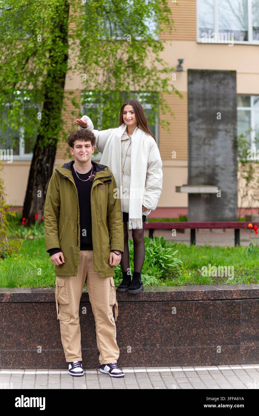 Tall woman standing with short woman hi-res stock photography and