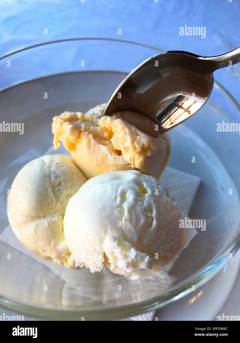 Eating three flavours ice creams: honey, cheese and olive oil. Spain. Stock Photo