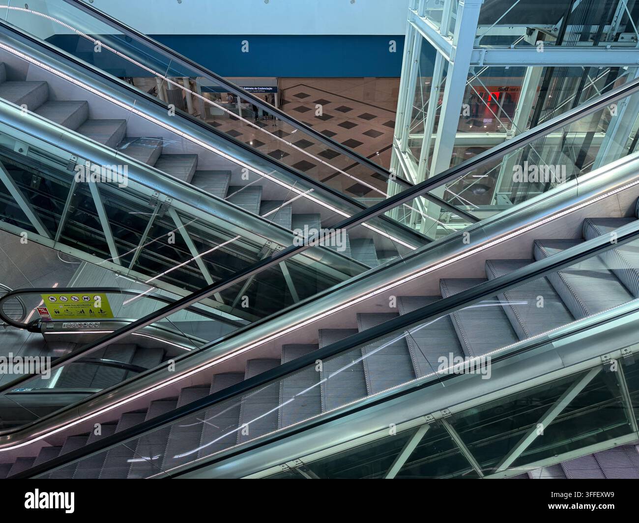 escalators moving up and down in a modern building, architecture, concept of retail, travel, transport Stock Photo