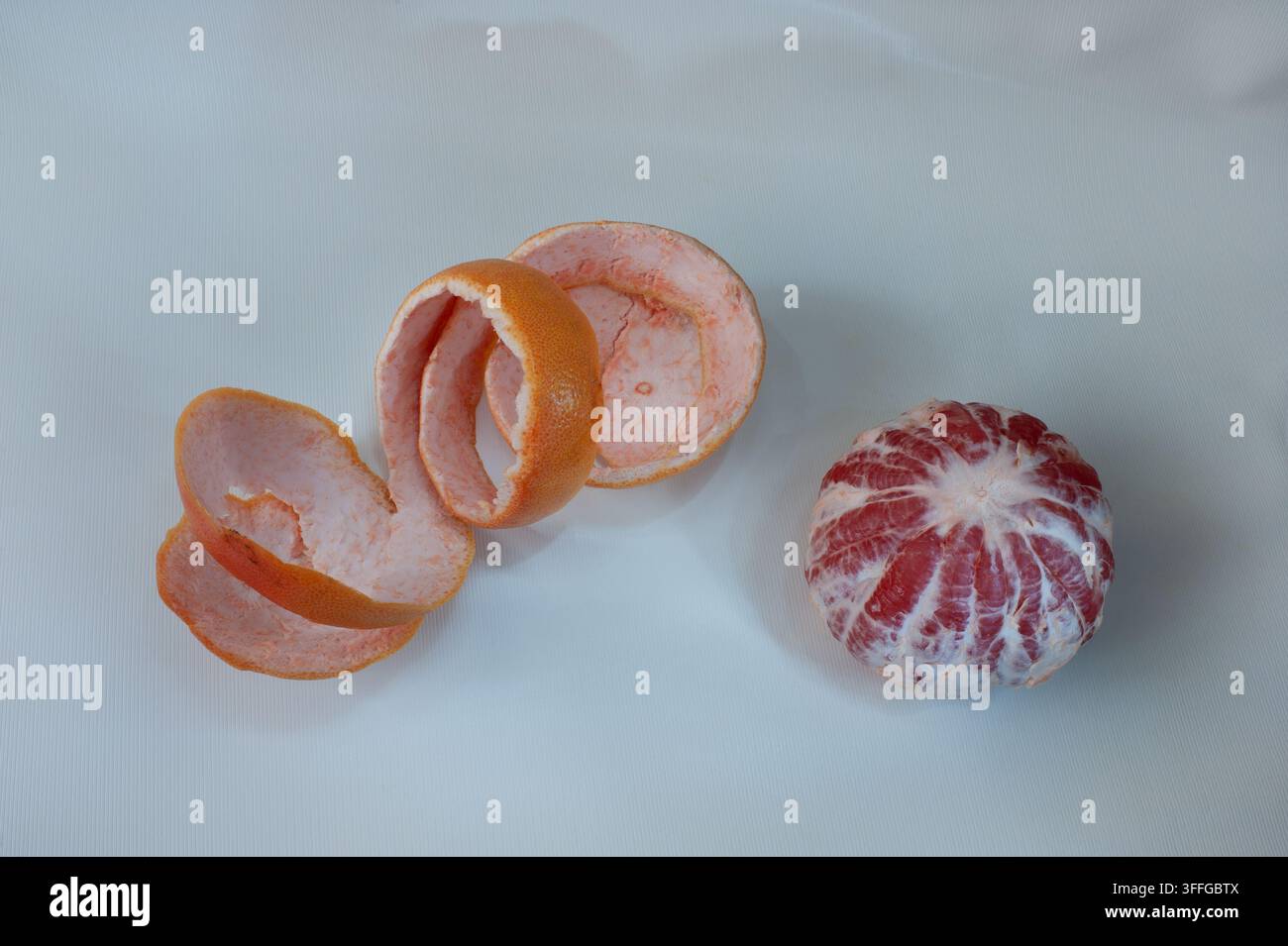Grapefruit citrus fruit with half isolated on white with clipping path.Peeled grapefruit Stock Photo