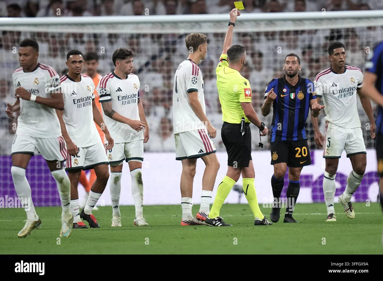inter-milan-s-hakan-calhanoglu-receives-a-yellow-card-during-a