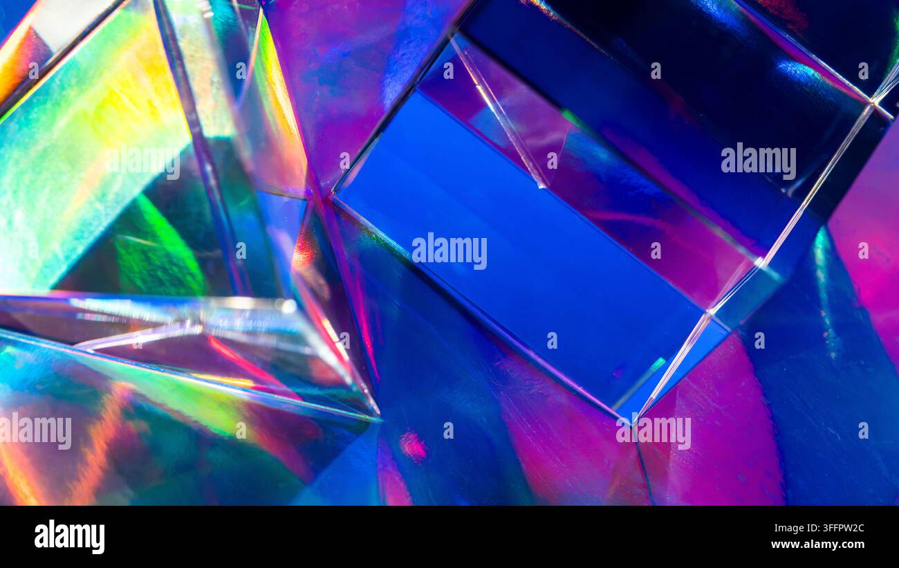 Futuristic abstract background with overlapping iridescent glass prisms reflecting vivid blue, purple, green, and pink light in a luminous geometric c Stock Photo