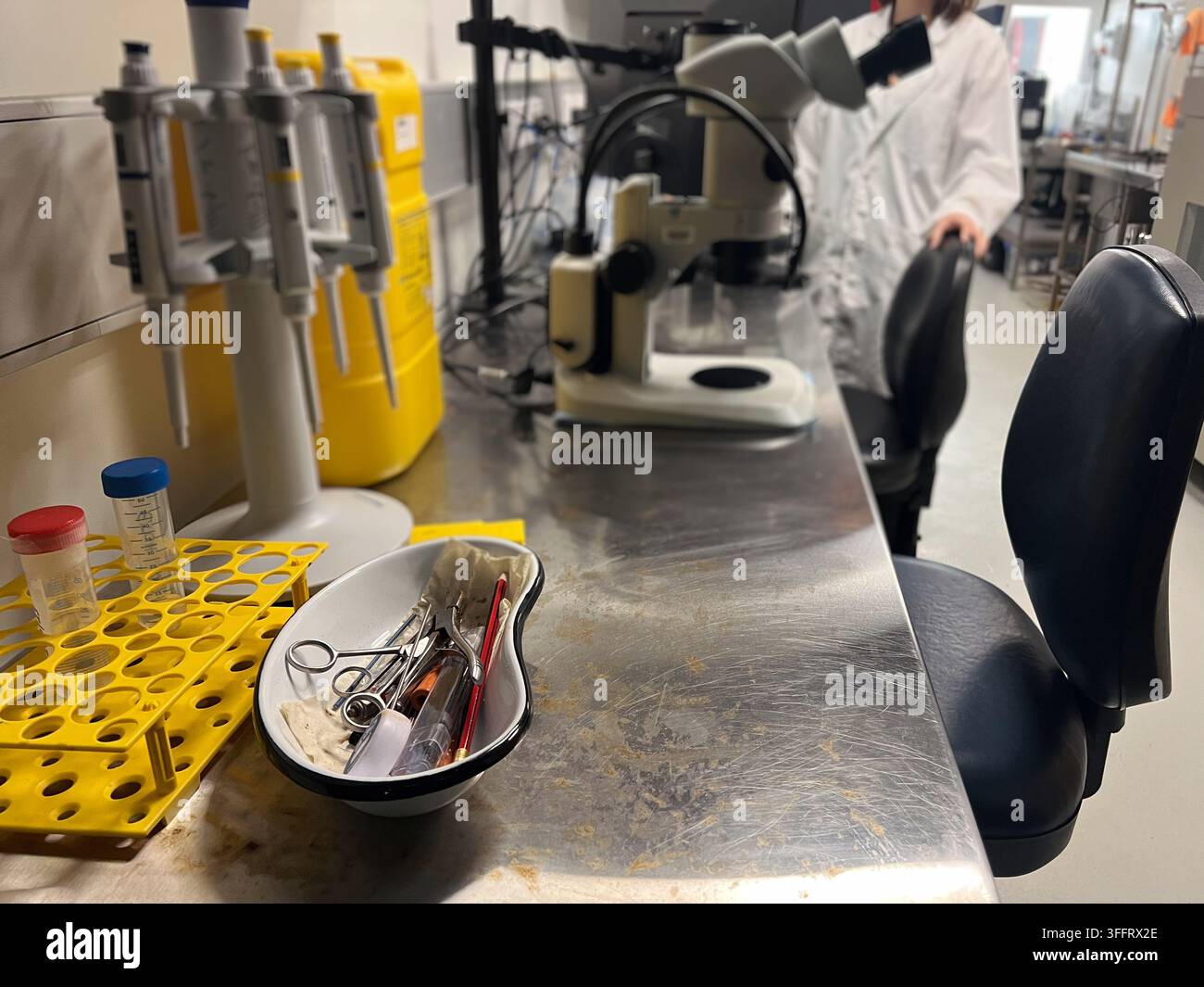 Close up of laboratory microscope on desk Stock Photo